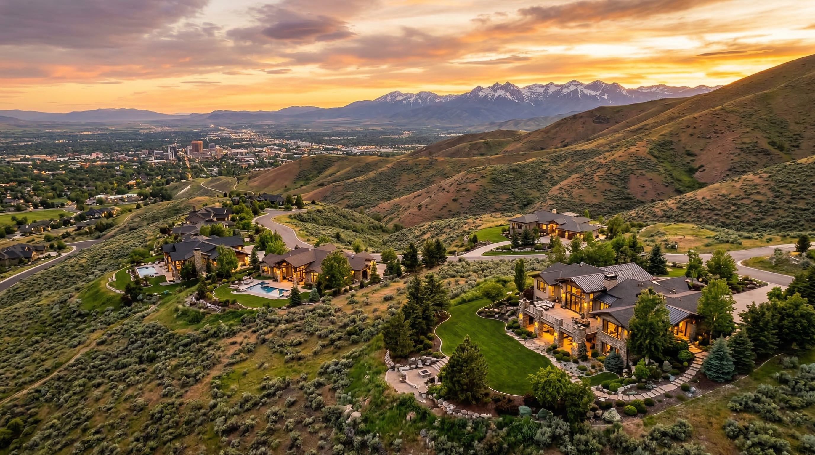 Luxury homes in the Boise foothills at golden hour with mountain views
